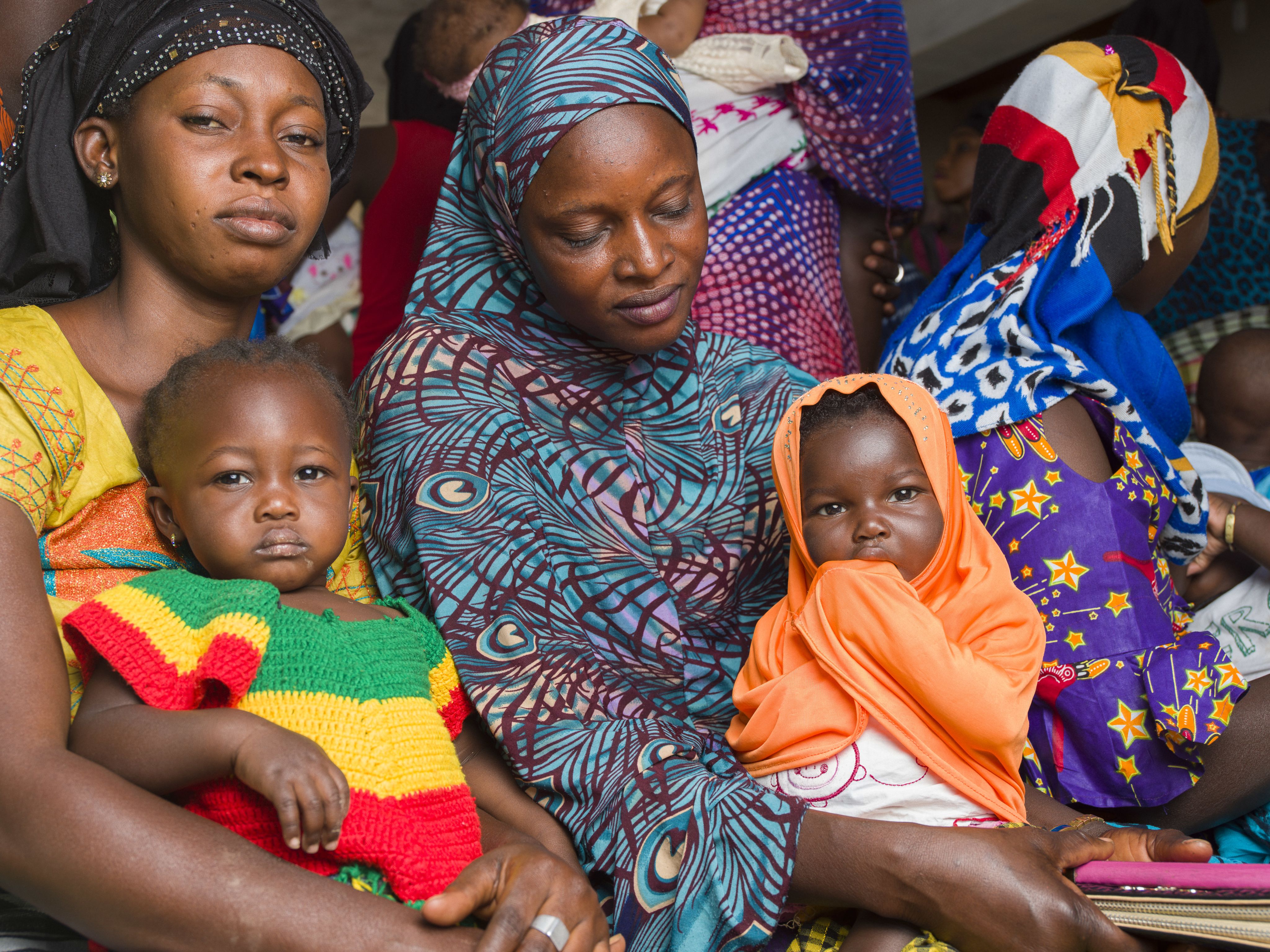 A group of mothers with their babies in The Gambia.