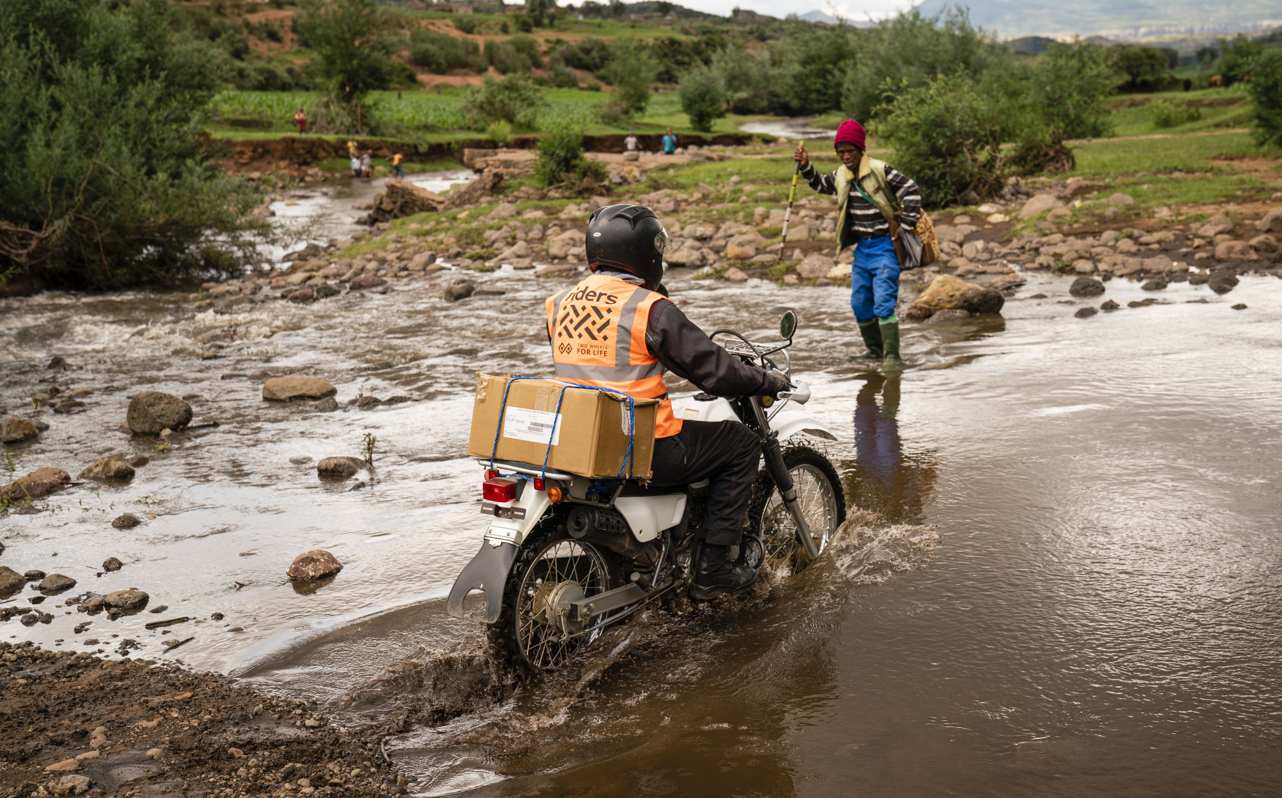 A Rider for Health crossing a water body in the Berea district of Lesotho