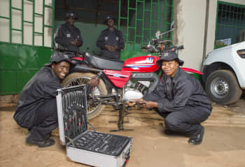 Riders for Health motorcycle maintenance personnel in The Gambia